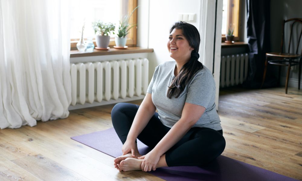 obese women doing yoga